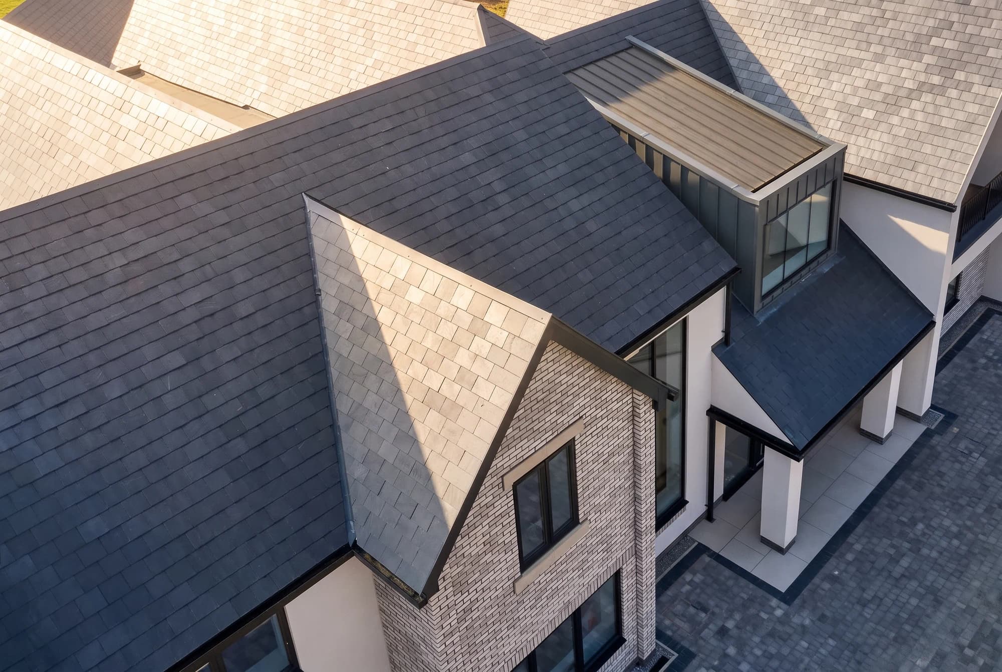 Aerial architectural detail of intersecting pitched roofs
